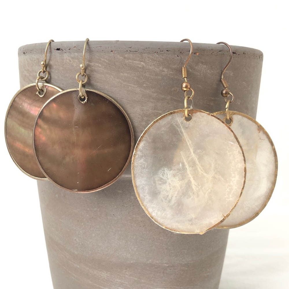 Shell style earrings with gold color edging